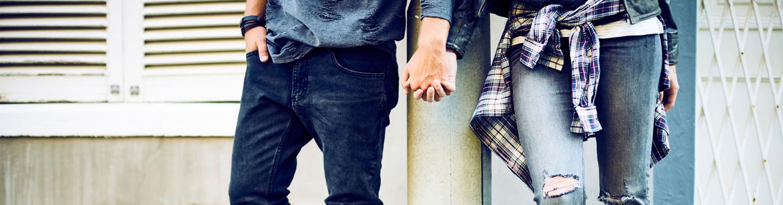 couple holding hands on the street