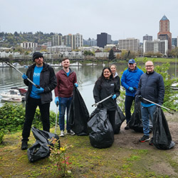 Advantis team members posing for a group photo during a River Clean-Up volunteer event.